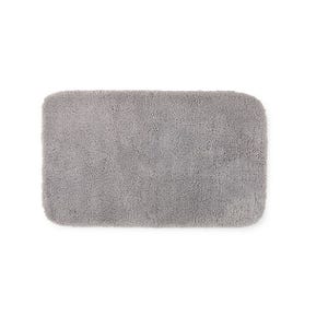 A rectangular, grey, fluffy rug with rounded corners.