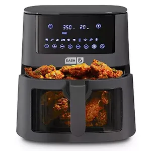 A black Dash 7-quart air fryer with a digital touch screen display on top, two stacked compartments with transparent windows, and chicken wings inside.