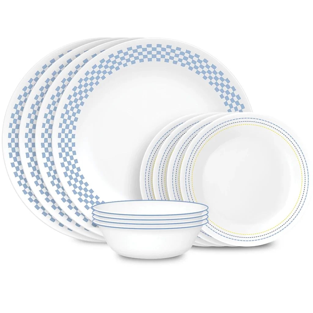 A set of blue and white patterned ceramic dinnerware, including plates and bowls.