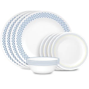 A set of blue and white patterned ceramic dinnerware, including plates and bowls.