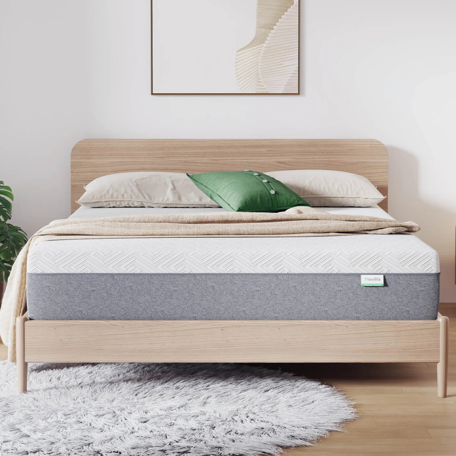 Novilla 6\“ Queen Mattress features a simple, modern design with a two-tone cover and wooden bed frame, accompanied by beige and green pillows, placed on a gray shag rug in a minimalistic bedroom setting.