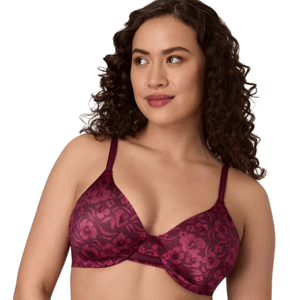 A woman is wearing a red bra with a floral pattern and adjustable straps. The bra features molded cups and an underwire design.