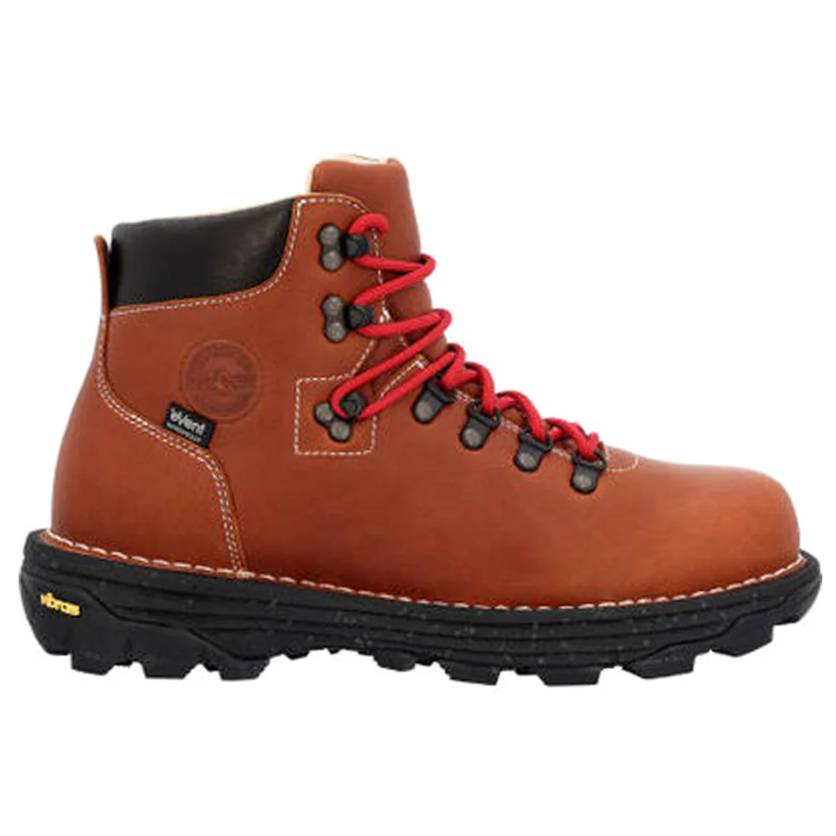 Brown hiking boot with red laces, black padded collar, and Vibram sole. Features metal eyelets, visible stitching, and a black brand tag on the side.