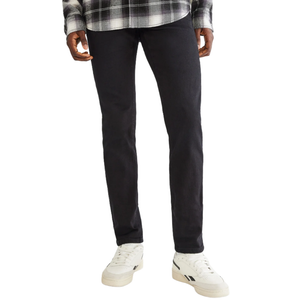 A person is wearing black jeans, white sneakers, and a black-and-white plaid shirt.
