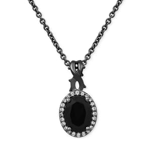 A necklace featuring an oval black onyx center stone surrounded by a halo of small diamonds, with an intricately designed bale, all set on a black chain.