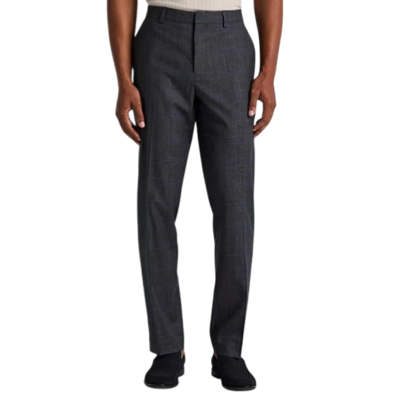 A person wears dark plaid dress pants with a slim fit, complemented by black shoes and a beige sleeveless top.