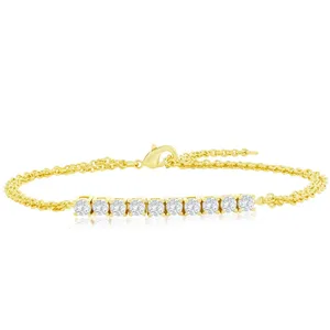 Gold bracelet with a row of round-cut diamonds.