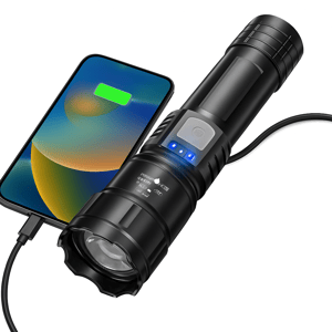 A black flashlight with a USB charging output charges a smartphone, indicated by the phone's screen displaying a charging icon. The flashlight has a button and LED indicators displaying its power status.