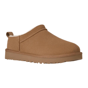 Brown slip-on slipper with a plush interior lining and a durable, grooved rubber sole. Ideal for indoor comfort with easy on-and-off access.