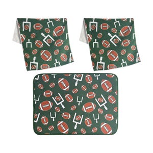 Set includes a drying mat and two microfiber towels, all featuring a green background with a pattern of footballs and goalposts.