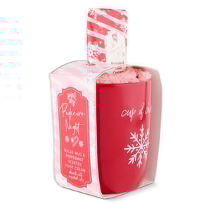 The gift set includes a red mug with a snowflake design, cozy pink socks, and peppermint-scented foot cream infused with essential oils, all packaged for a pedicure night.