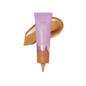 Tarte Maracuja Juicy Glow Foundation, shown in a purple tube with golden floral design and a swatch of the foundation beside it.