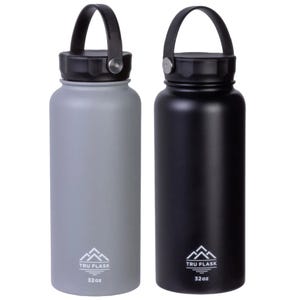 Two 32-ounce insulated water bottles, one gray and one black, each with a carrying handle on the lid and branded with the \“TRU FLASK\“ logo.
