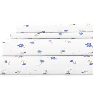 A 4-piece queen sheet set with a white background featuring a delicate blue floral print. The set includes a fitted sheet, a flat sheet, and two pillowcases.