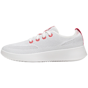 White mesh sneaker with red accents, featuring white laces, red eyelets, and a textured white sole.