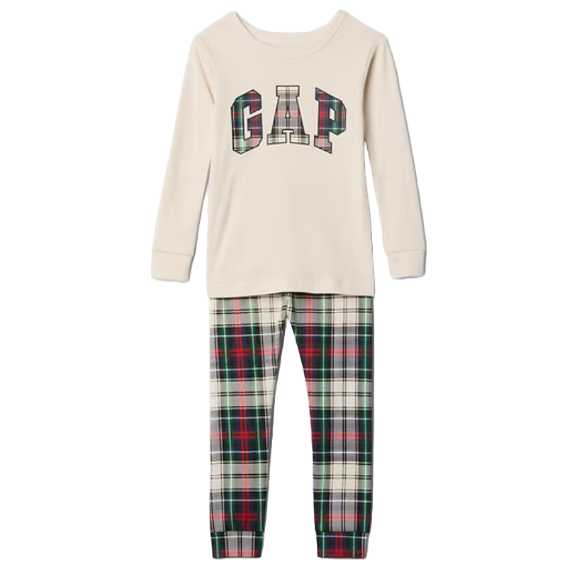 Kids' pajama set featuring a cream long-sleeve top with a plaid \“GAP\“ logo and matching plaid pants in red, green, and cream.