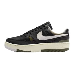 A low-top sneaker with a black leather upper, white swoosh, and cream midsole. It features a perforated toe box and padded collar.