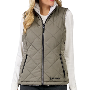 Quilted vest with a full front zipper, two zippered pockets, and sherpa lining, featuring a Free Country logo in the lower corner.