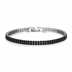 A tennis bracelet with black stones set in a silver band, featuring a secure metal clasp.