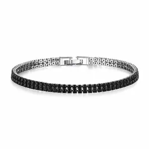 A tennis bracelet with black stones set in a silver band, featuring a secure metal clasp.