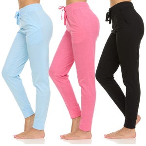 A set of three leggings with pockets in light blue, pink, and black, featuring a drawstring waistband and slim fit style.