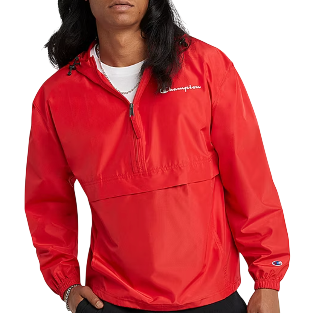 Red Champion windbreaker jacket with a half-zip design, elastic cuffs, and logo detailing on the chest and sleeves.