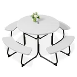 Round folding picnic table set with a white tabletop, integrated with three curved benches and a central umbrella hole. Decorated with a small flower arrangement.