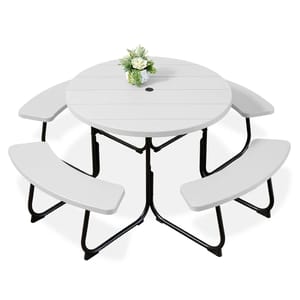 Round folding picnic table set with a white tabletop, integrated with three curved benches and a central umbrella hole. Decorated with a small flower arrangement.