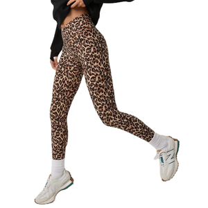 High-waisted crossover leggings with a leopard print design, paired with white sneakers and socks.