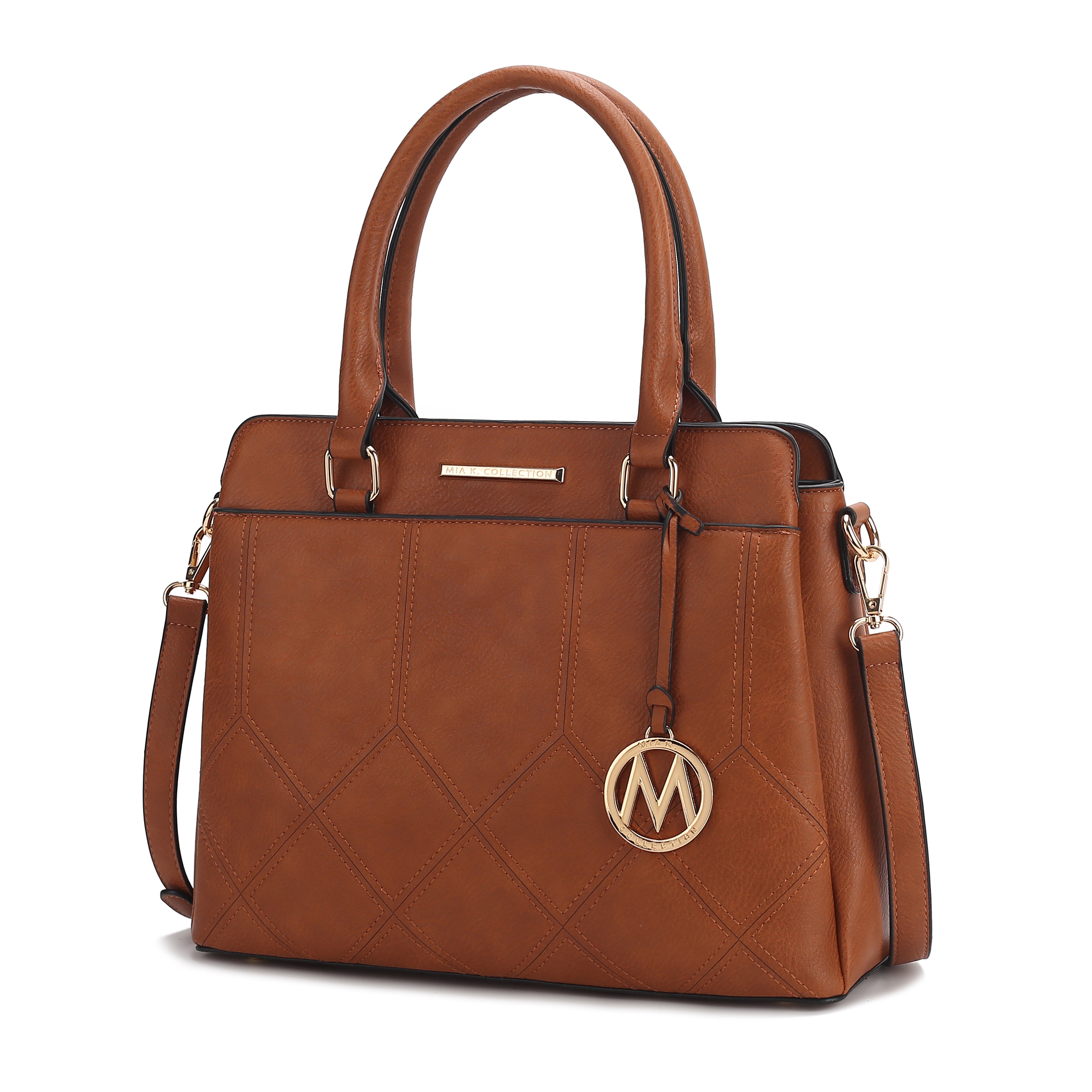 A brown leather handbag with quilted stitching, dual top handles, a detachable shoulder strap, and a gold-tone circle charm featuring the letter \“M\“.