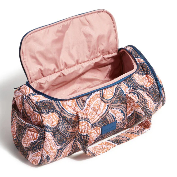 Vera Bradley Ultralight Active Duffel Bag in a paisley pattern with peach and navy colors, featuring a spacious interior, two handles, and side pockets.