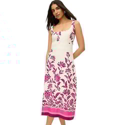 Sleeveless white dress with a fitted bodice and pink floral patterns extending to the hem, ending at a midi length.