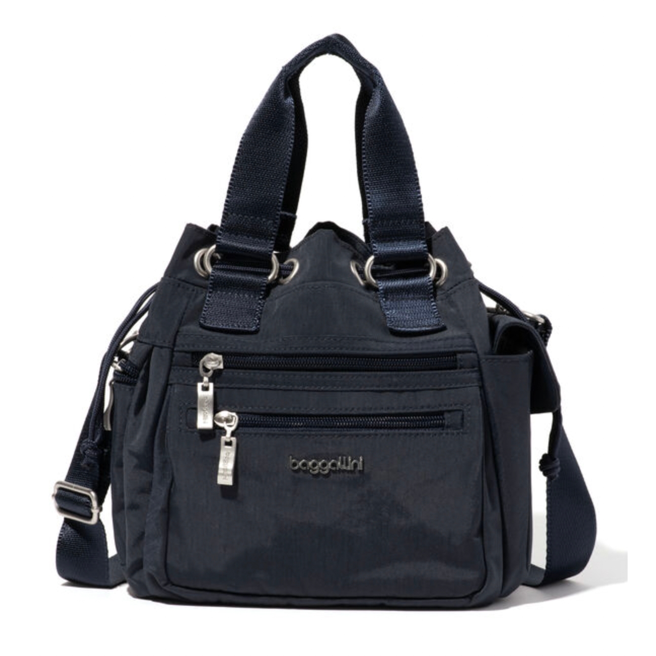 A dark blue Baggallini handbag features dual handles, a crossbody strap, and multiple zippered pockets with silver-tone hardware.