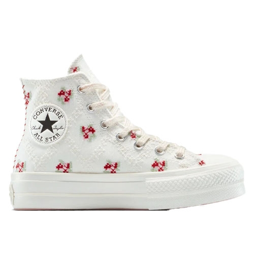 A white high-top Converse All Star sneaker with red floral embroidery and silver eyelets.
