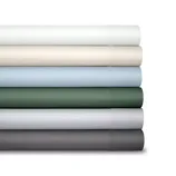 A stack of six rolled-up bed sheets in various colors: white, cream, light blue, dark green, light gray, and dark gray.