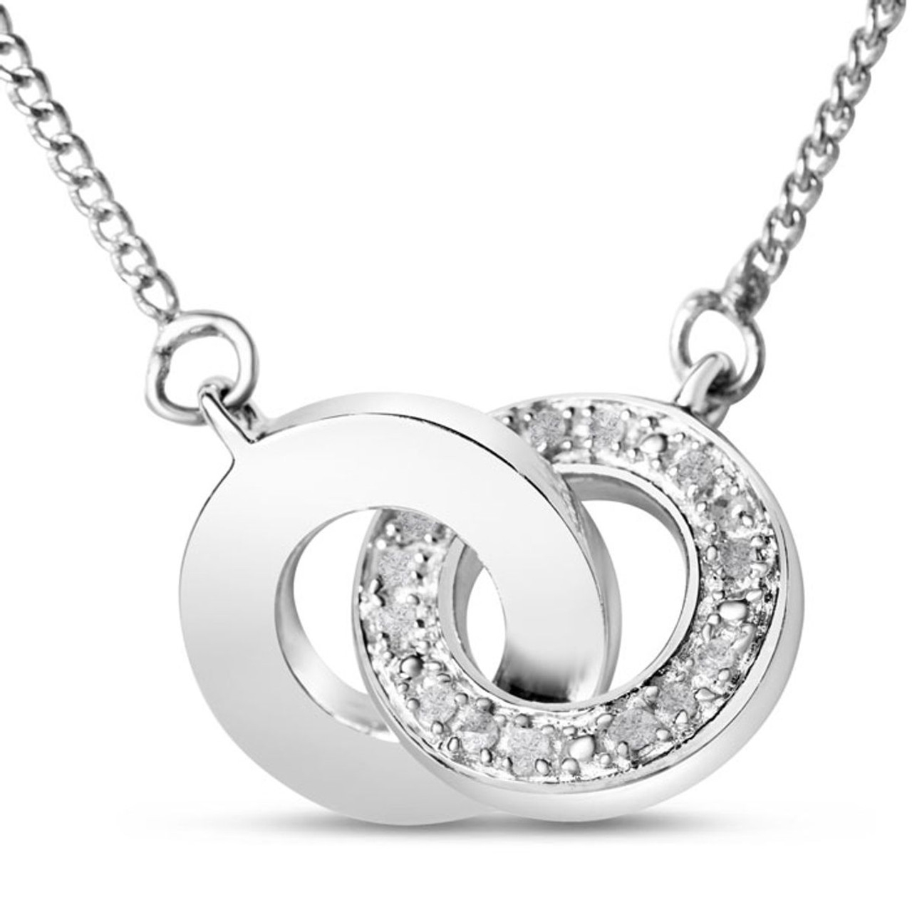 A necklace featuring two interlocking circles, one polished and the other adorned with small diamonds totaling 1/4 carat, crafted in a silver or white gold finish.