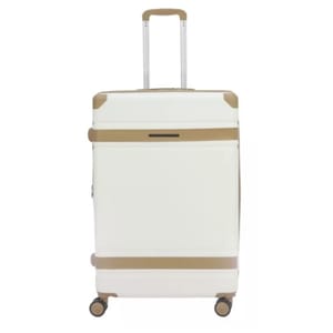 A white hard-shell suitcase with tan accents, featuring four wheels and a telescopic handle.