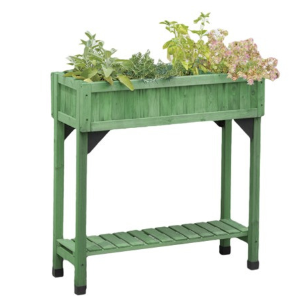 Green wooden raised planter with herbs and flowers, featuring a rectangular box design and sturdy legs, includes a lower slatted shelf for additional storage or display.
