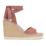 Pink wedge sandal with a woven espadrille heel and an ankle wrap tie.