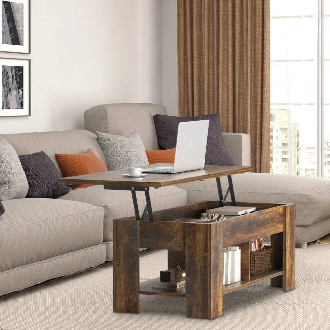 A lift-top coffee table with a rustic wooden finish features a raised tabletop for convenience, ideal for work or dining. It offers storage space below and has a sturdy design suitable for a modern living room.