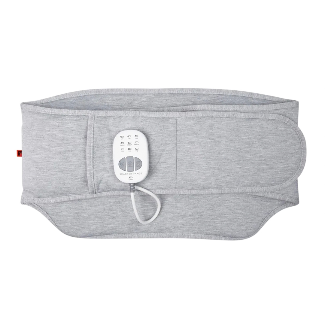 The Sharper Image Heated Back Massager is a grey wearable device featuring adjustable heating and massage settings, controlled by an attached remote. It is designed to wrap around the lower back for comfort and relief.