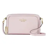 A pastel pink Kate Spade New York crossbody bag with gold-tone hardware and dual zippers, featuring an adjustable strap and logo embossed on the front.