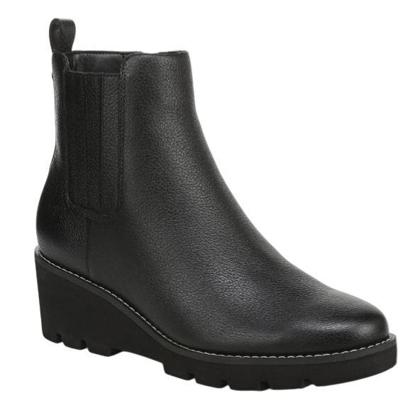 Black ankle boot with a wedge heel and textured finish, featuring elastic side panels for easy slip-on wear.