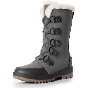 Black, mid-calf snow boots with fur lining, lace-up fastening with metal buckles, and a thick, brown, treaded sole.