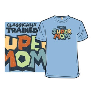 Light blue t-shirt featuring bold, colorful text with a retro design that reads \“Classically Trained Super Mom.\“