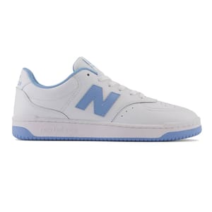 White New Balance sneaker with light blue accents, featuring the signature \“N\“ logo on the side and a blue sole.