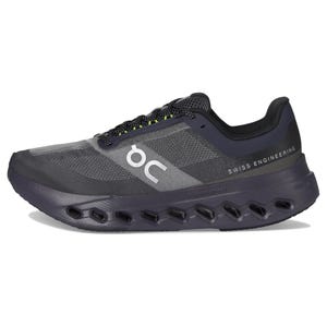 Black and gray athletic shoe with \“On\“ logo and \“Swiss Engineering\“ text, featuring a Cloudtec sole design.