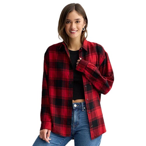 A woman is wearing a red and black plaid flannel shirt over a black top, paired with blue jeans.