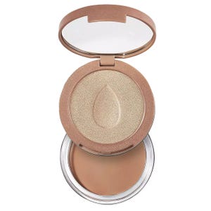 The BeautyBlender Bronzer & Highlighter Duo features a compact case with a shimmering highlighter on top and a warm matte bronzer beneath, designed for convenient application.