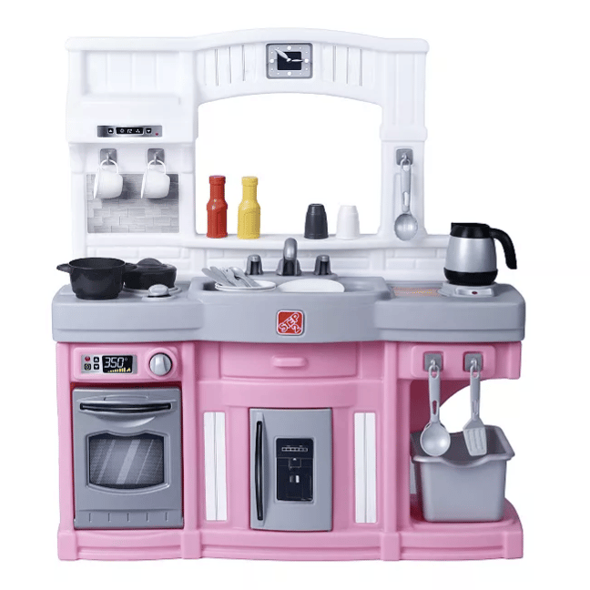Toy kitchen set with a pink and gray color scheme, featuring a sink, stove, oven, coffee pot, utensils, and condiment bottles.